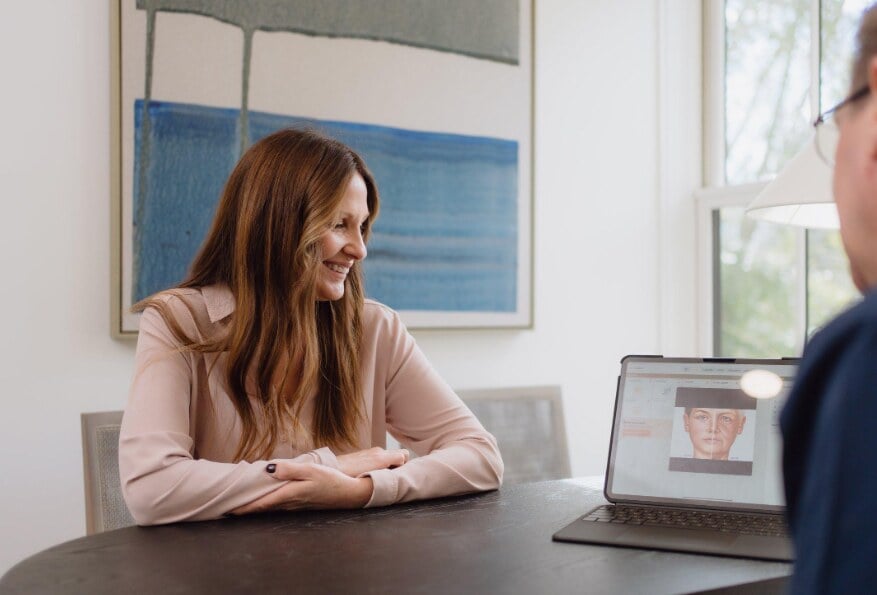 Patient discussing facial fat transfer options during a consultation in San Antonio