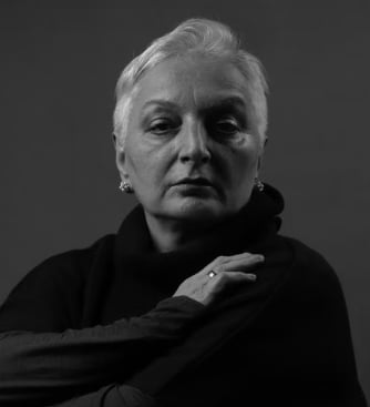 Black-and-white portrait of a mature woman, the kind of patient who asks about a mini facelift